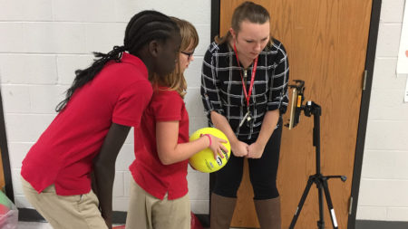 Haley working with students.